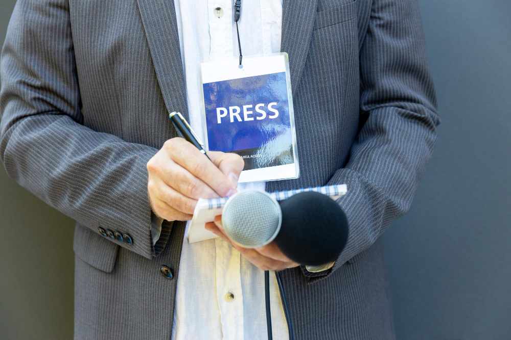 A press worker covering a conference.